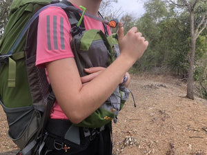 Close up of female hiker wearing Aarn pack with front pockets
