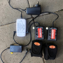 Load image into Gallery viewer, Two Ay-up batteries connected to charging device.