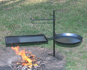 Cookstand stands next to campfire ready for use