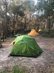 Wilderness Equipment Space 2 Tent pitched at campsite surrounded by trees