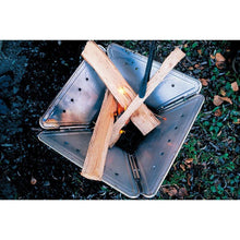 Load image into Gallery viewer, Snow Peak large fire pit top view with sticks ready to light